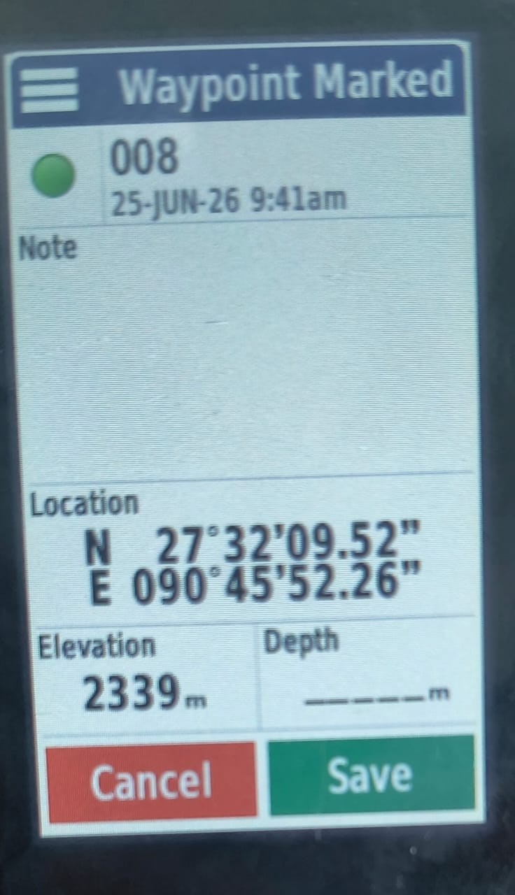 Handheld GPS unit displaying a marked survey waypoint with coordinates and elevation.